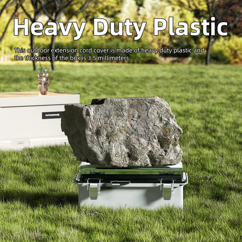 Killer Heavy Duty Outdoor Extension Cord Cover With Hinged Clear Window Stops Water In Its Tracks To Check Status Fast Rock Solid Weatherproof Shield Guards Outlets And Cords Against Rain And Debris Tough As Nails Build Includes 9X5X4.3 Model resting on grass, showing heavy duty plastic material.