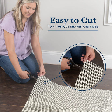 Woman cutting Rug Gripper Pad For Hardwood Or Tile Floors 2x3 Ft Thick Non Slip Under Rug Mat Keeps Rugs From Bunching And Sliding.