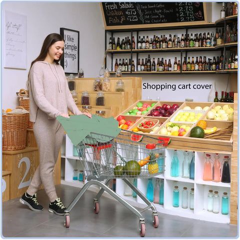 Woman using All In One Baby Car Seat Cover And Canopy with breathable buttery soft stretch fabric in a shopping cart, light green.