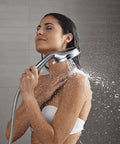 Woman using All In One Handheld And Docked Showerhead With Full Coverage Angled Nozzles For An Intense Rinse And Easy Switch Between Modes