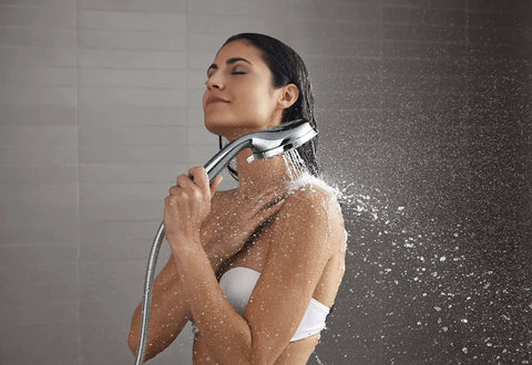 Woman using All In One Handheld And Docked Showerhead With Full Coverage Angled Nozzles For An Intense Rinse And Easy Switch Between Modes
