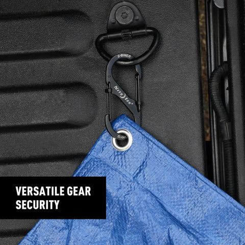 SlideLock Stainless Steel S Biner Dual Gate Carabiner securing blue tarp on black surface with dual locking design.