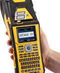 Built Tough Portable Handheld Label Maker With Rechargeable Battery For Multi Line Wire Tagging And Panel Identification Includes Hard Shell Case Usb Charger And Pre Loaded Ribbon held in hand, showing screen and keyboard.