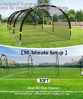Backyard Baseball Batting Cage With 30ft By 12ft By 8ft Frame Portable Practice Net Featuring Pitching Machine Hole Durable 1.25 Inch Mesh Fiberglass Poles Iron Stakes And Carry Bag For Easy Setup And Realistic Swing Practice, shown set up in a backyard.