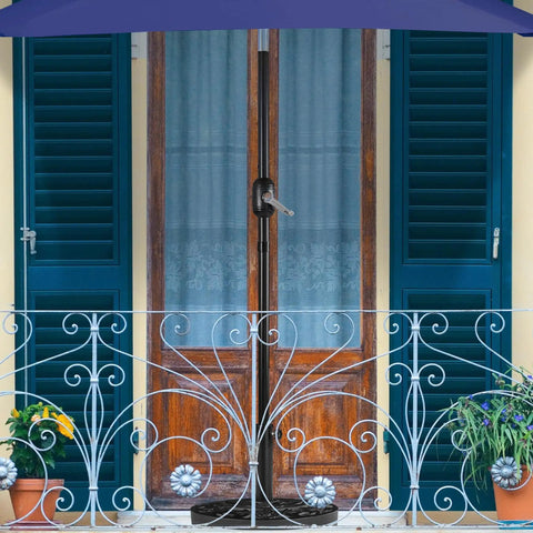 Heavy Duty Half Round Umbrella Base Stand For Patio Umbrellas Resin Outdoor All Weather Base Rock Solid Stability For Any Weather 20 Inch Diameter 13 Inch Radius 13 Inch Height Fits 38mm And 49mm Poles seen on a balcony setup with iron railings and blue shutters.