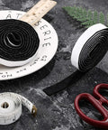 Four Rolls Of Half Inch Wide By Sixty Inch Long Self Adhesive Felt Strips Heavy Duty Polyester Pads displayed on a table