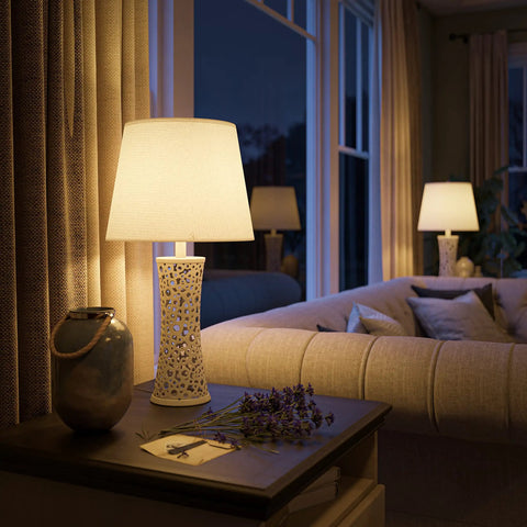 Bright White Ceramic Table Lamp With Bubble Pattern, 25.5 Inch Tall, 13.5 Inch Drum Shade in a cozy living room setting