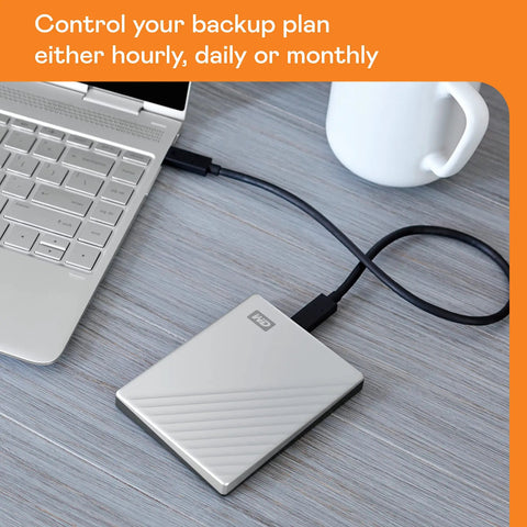 2TB My Passport Ultra Portable External Hard Drive with Ransomware Defense connected to laptop, silver finish