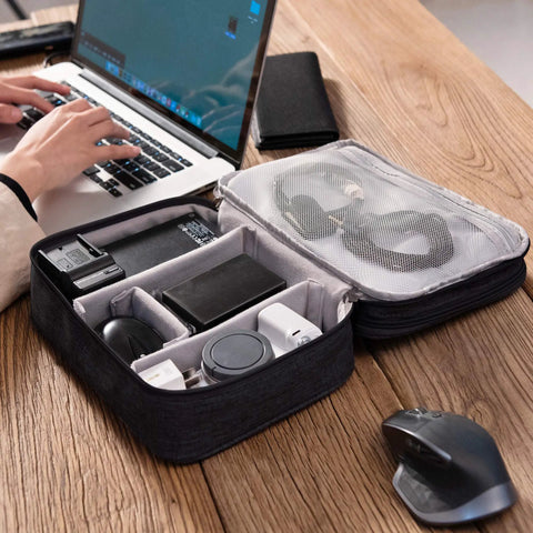 Waterproof Double Layer Electronics Organizer Bag For Cables Chargers Power Banks Adapters USB Cables Kindle Hard Drives And More Portable Travel Case On The Go With Adjustable Dividers open on desk with tech accessories