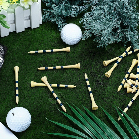 500 Pcs Bamboo Golf Tees 3-1/4 Inches Long Wooden Tees For Golf Practice On The Course Natural Color With Blue Stripes Stable Durable Teeing Accessories Pack scattered on grass with golf balls and greenery.