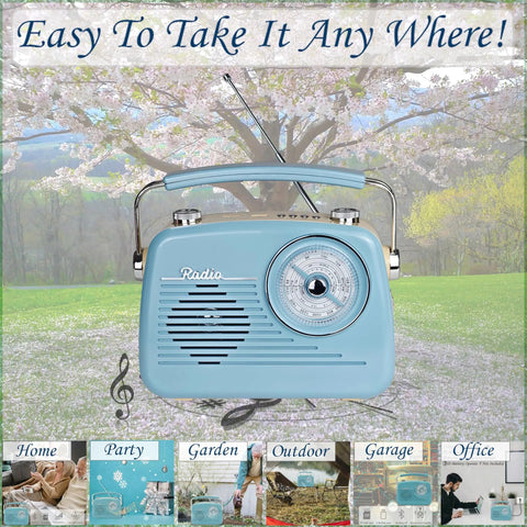 Grab N Go Portable AM FM Shortwave Radio Bluetooth Speaker in blue, with handle, set on grass with cherry blossoms in background