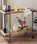 Stylish bar cart with cocktail supplies, glassware, and decor. Perfect for entertaining with drinks and snacks.