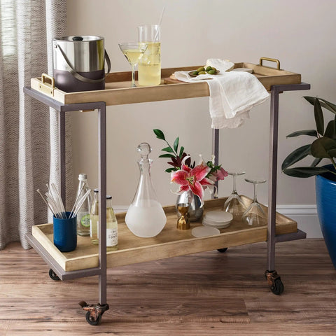 Stylish bar cart with cocktail supplies, glassware, and decor. Perfect for entertaining with drinks and snacks.