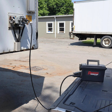 Portable Trailer Light Tester With 7 Way Round Pin SAE J560, Short Circuit Protection in use between trailer and truck