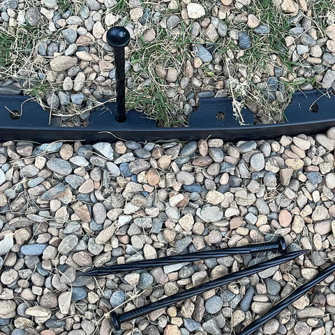Heavy Duty Plastic Landscape Anchoring Spikes Set 50 Pieces 8 Inch Nylon Spiral Stakes on gravel
