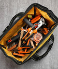 Top view of 3 Pack Heavy Duty Tool Bag With Waterproof Hard Bottom filled with assorted tools, 13 Inch, yellow interior.