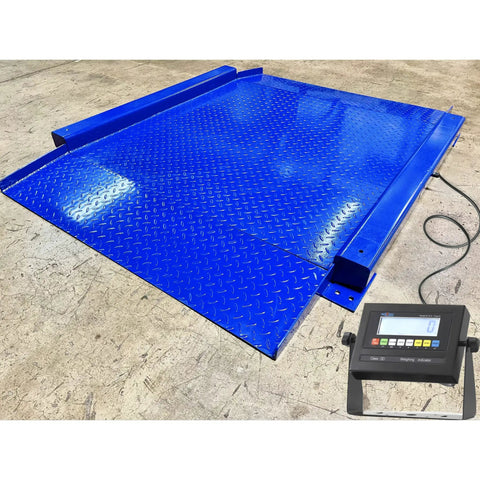 Heavy Duty Low Profile Drum Scale Built Tough With Smooth Hinged Ramps For No Sweat Barrel Rolling And Rock Solid Weighing Capability Up To 5000 Pounds With Spot On One Pound Accuracy NTEP Approved on a blue platform with digital display.