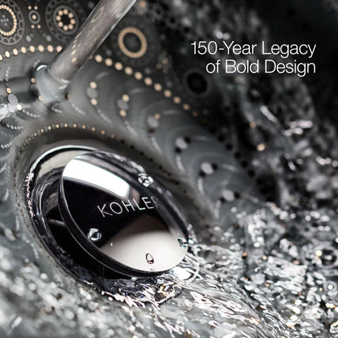 Close-up of Kohler sink drain with swirling water and 150-year legacy design text