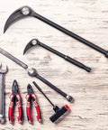 Beefy Heavy Duty 10 Inch And 20 Inch Indexing Pry Bar Set For Mechanics alongside various hand tools on a wooden surface.