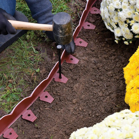Installing Scalloped Top No Dig Landscape Edging With Extra Anchoring Spikes In Red 100 Foot Kit around flower bed