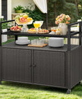 Outdoor Storage Cabinet With Wheels And Black Glass Top For Patio And Poolside No Fuss All Weather Wicker Cart shown in garden