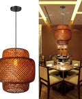 Hand Woven Bamboo Pendant Light 16 By 17 Inch Rattan Hanging Lamp With Wicker Basket Shades lit in restaurant setting