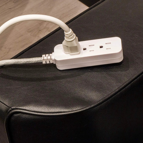 Eight Ft Braided 3 Outlet Power Strip Surge Protector Two Pack with Flat Plug Extension Cords 250 Joules UL Listed White on couch