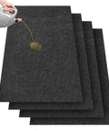Four Piece Oil Spill Mat Set 36 By 60 Inches for garage floor protection, showing oil being poured on one of the mats.
