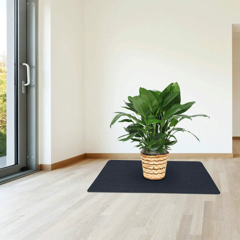 All Around Multi Purpose Recycled PVC Floor Mat For Indoor And Outdoor Use Go To Entryways Garages Kitchens And Patios Durable Water Resistant Dirt Shield 24 By 36 Inches Black shown in living room with plant
