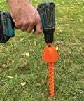 Screwdriver 2.0 Drill Attachment For Quick Ground Screw Installation And Removal in use with cordless drill on grass
