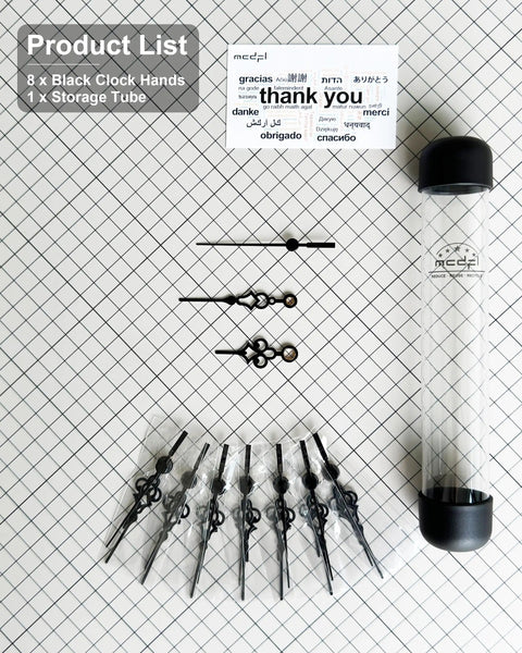 Eight Piece Black Clock Hands Set For 140mm Clock Faces Antique Style With Thick Mounting Hole displayed with tube