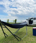 Adjustable Hammock With Sturdy Collapsible Stand For Camping And Outdoor Use 550 Lb Capacity Double Hammock shown outdoors