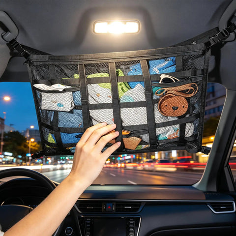 Ceiling Cargo Net With 3 Pockets And Double Layer Mesh Overhead Storage Organizer For Cars And SUVs 31.5x21.6 Inches in use.