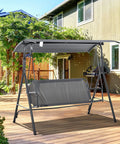 Three Person Outdoor Porch Swing With Stand And Tilt Canopy on wooden deck, steel frame, bench style seat, gray finish.