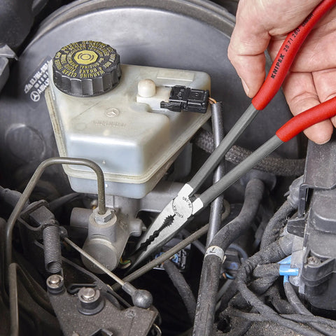 Mechanic using 4 Piece Automotive Pliers Set In Foam Tray Storage With Combo Pliers for engine bay auto repair.