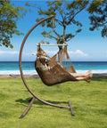 Caribbean Style Rope Hammock Chair With 40 Inch Steel Spreader Bar And Anti Slip Rings Soft Spun Cotton Rope by the sea