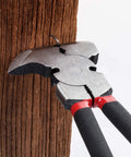 Heavy Duty Fence Pliers Set With Nail Puller, Staple Puller And Cutting Pliers For Construction And Carpentry in use on wood