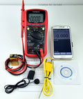 Red TP9605BT Auto Ranging Digital True RMS Smart Multimeter with cables, USB, and accessories next to smartphone display