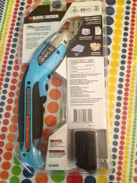 Blue Black & Decker Power Scissors in packaging on colorful polka dot background