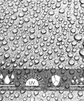 Close-up of water droplets on waterproof surface of 7 Mil White 8x10 Foot Poly Tarpaulin Tarp Beefy Heavy Duty Waterproof Cover