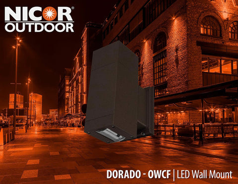 Dorado 36W Outdoor LED Wall Mount Cylinder Light in Bronze, modern tower with convex glass at night, architectural backdrop
