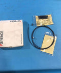 Keyence Fu-53Tz Transmissive Fiber Optic Sensor Unit with 1m cable and components on blue surface