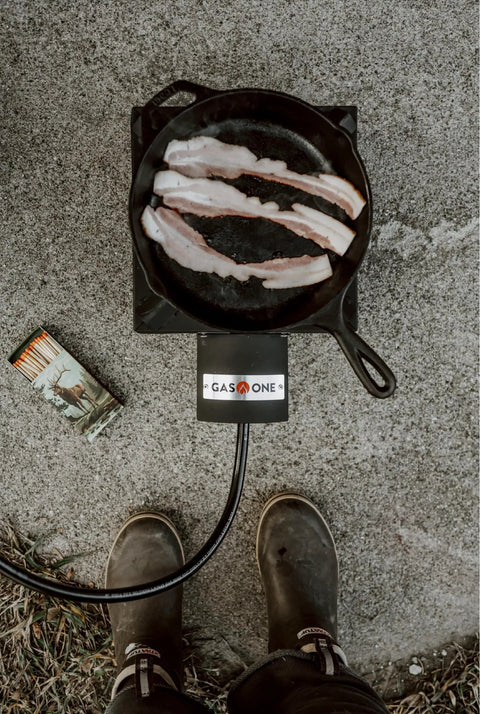 Top view of bacon cooking on a High Pressure Propane Burner For Outdoor Cooking With Heat Shield And Guard.