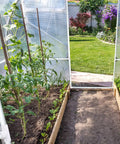 Greenhouse interior with plants using 42-Piece Half Inch PVC Pipe Fittings Elbow Set for garden structure support