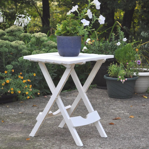 Quik-Fold Plastic Side Tables 2 Pack White with a plant, lightweight patio table shown unfolded outdoors.