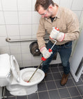 Heavy Duty Toilet Auger With Bulb Head Snake And Pro Clog Remover For Modern Low Flow Toilets Smooth Operator Drain Tool in use.
