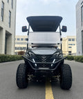 Slick White Two Plus Two Golf Cart With 48V 150Ah Lithium Battery Backup Camera, front view on a city street.