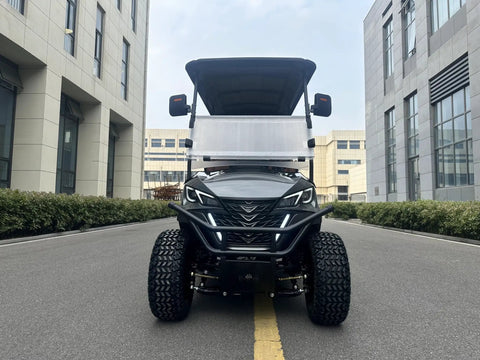 Slick White Two Plus Two Golf Cart With 48V 150Ah Lithium Battery Backup Camera, front view on a city street.