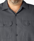 Badass Men Short Sleeve Utility Button Down Workshirt In Charcoal With Stain Resistant Cotton Polyester Blend For Tough Job Site Grind and Easy Relaxed Fit That Handles Every Day Hustle, front view with button detail.