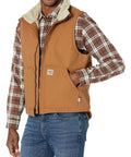 Men's Top Shelf Flame Resistant Duck Vest Straight Up Arc Protection With Heavy Insulated Sherpa Lining And Pro Level Vislon Front Zipper In Dark Brown X Large Tall worn over plaid shirt.
